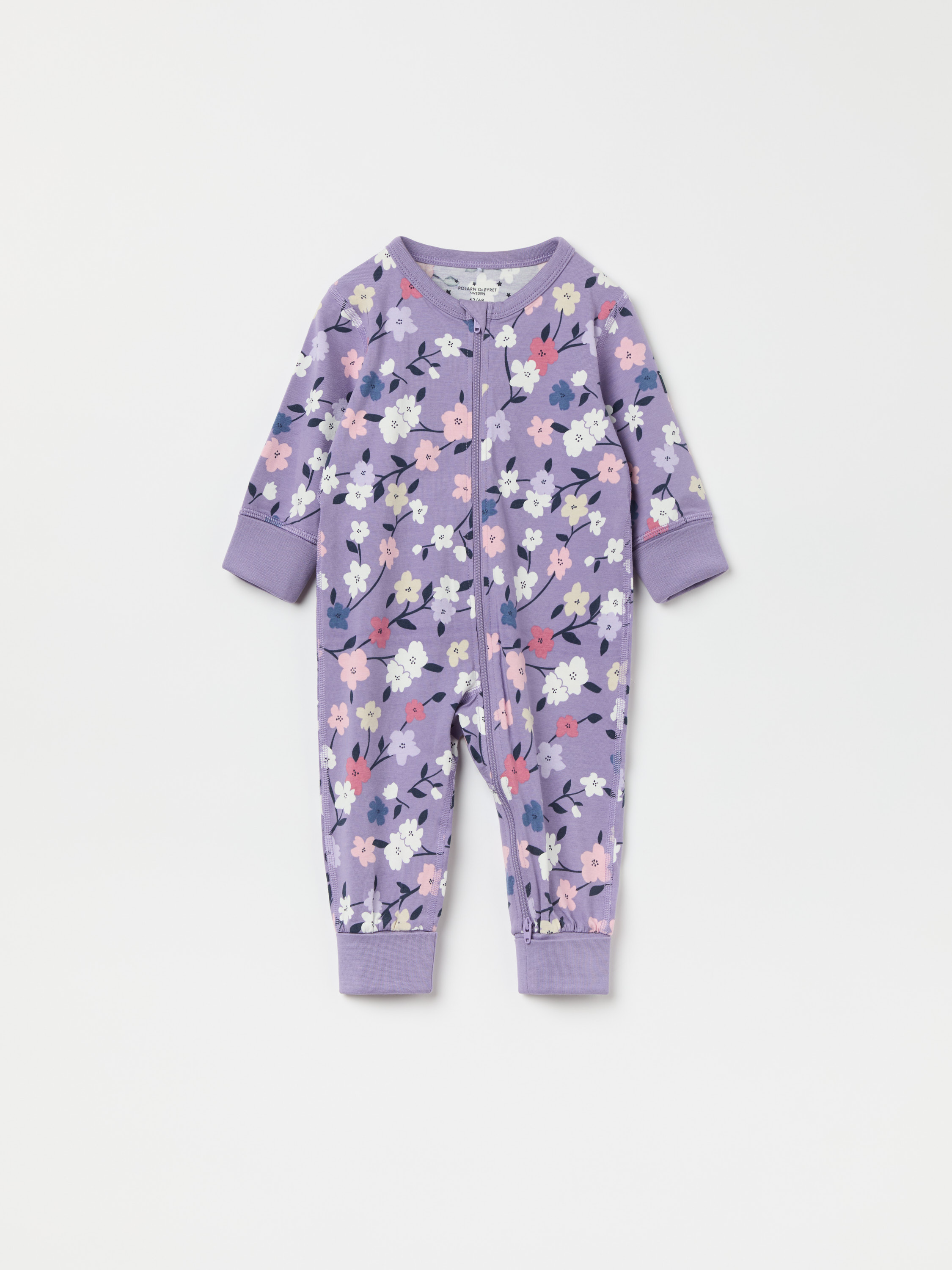 Pyjamasoverall med nedvikbara muddar blommor